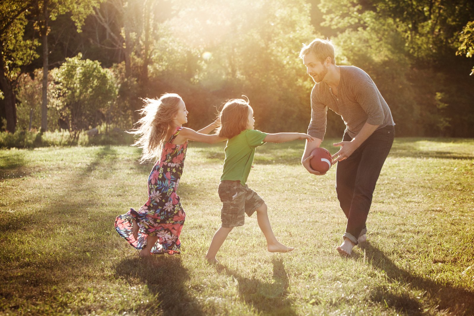 kids playing with their dad