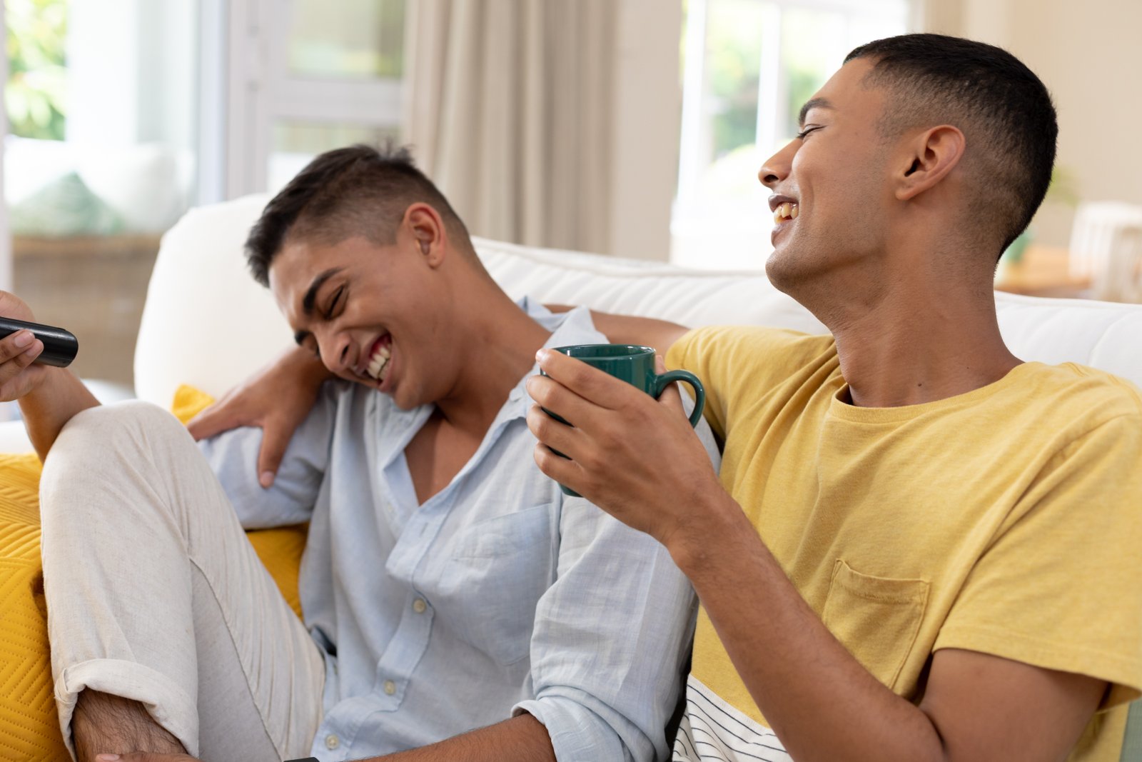 Gay couple enjoying the shared TV moments together